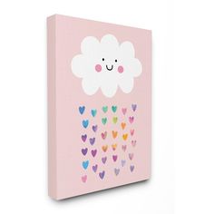 a pink canvas with hearts and a cloud painted on the side, hanging up against a wall