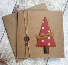 two brown cards with red and white christmas tree on them, sitting next to each other