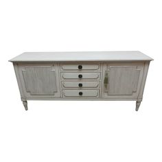 an old white cabinet with drawers and knobs