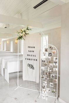 a white room with pictures on the wall and a sign that says from now until forever