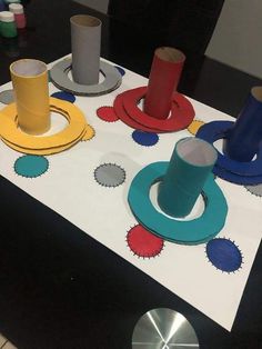 several different colored objects sitting on top of a white table with holes in the middle