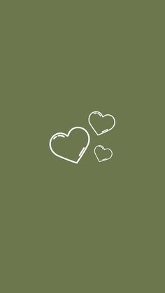 two hearts drawn in white on a green background