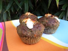 two muffins sitting on top of a colorful plate