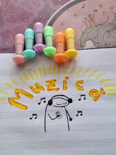 an art project with crayons and music notes