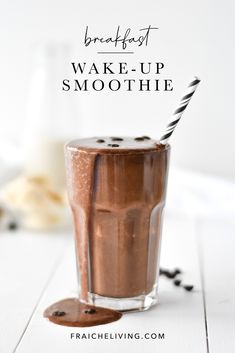 a smoothie in a glass with chocolate on the side and text overlay reading breakfast wake - up smoothie