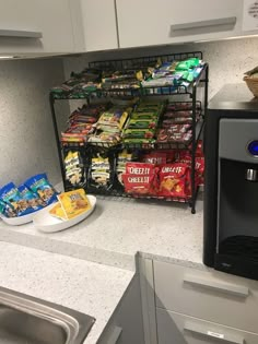 a kitchen counter with food on it next to a microwave and dishwasher filled with chips