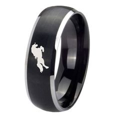 a black and white ring with a horse on it