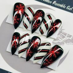 Welcome to LD Nails!  Hi, I'm Bur and I'll be your long distance nail ghoul 😜 Read on for the obligatory written description of what you see in the pictures, plus some other important stuff..  🖤 One set of 10 REUSABLE Press On Nails 🖤     🖤 Made to order in your shape & size 🖤  Christmas Chrome: Black, white and red gothic Christmas press on nail set with hand painted red chrome snowflakes and striping detailing.  👉 Please leave your finish preference and (if applicable) custom sizing in t Christmas Gothic Nails, Black And White Christmas Nail Designs, Valentines Day Nails Red And Black, Red Chrome Valentine Nails, Purple Christmas Nails Acrylic, Goth New Years Nails, Halloween Christmas Nails, Goth Holiday Nails, Black Red Silver Nails