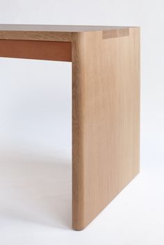 a wooden table with a white background