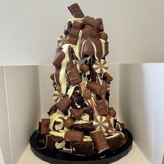 a cake made to look like a pyramid with chocolate and marshmallows on top