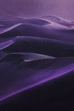 purple sand dunes with stars in the sky