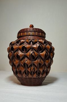 a large wooden basket sitting on top of a table