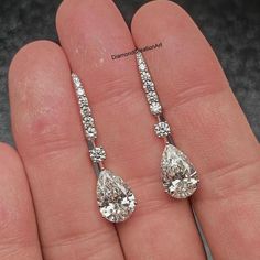 Moissanite Dangle Drop Earrings, 5.40 tcw Pear Cut Moissanite Drop Earrings, 14K White Gold Wedding Earrings, Engagement Bridal Earrings Detail about stones Moissanite & Simulated Stone: ----------------------------- ➠Stone Shape : Pear ➠Stone Size : 11x8 MM ➠Weight: 5.40 TCW ➠Color: Colorless ➠Cut: Excellent ➠Clarity: VVS ✍This Listing's images are only for Imagin about this item. This is all our photography. If you place the order then the same item we can make it. ✍ This displayed all product Elegant Hand-set Pear-shaped Earrings, Elegant Hand Set Pear-shaped Earrings, Pear-shaped Fine Jewelry Earrings For Wedding, Pear-shaped Diamond Bridal Earrings For Anniversary, Pear Shaped Prong Setting Wedding Earrings, Diamond White Pear Bridal Earrings With Prong Setting, Diamond Cut Drop Bridal Earrings As Gift, Pear-shaped Prong Setting Wedding Earrings, Formal Bridal Earrings With Diamond Cut In Teardrop Shape