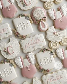 decorated cookies are arranged in the shape of baby carriages