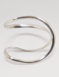 Free shipping does not include tracking or insurance unless specified. Upgrades available for added security and peace of mind. I am selling an  elegant and versatile piece of Danish modernist jewellery, the infinity bangle. The infinity bangle is produced  by Georg Jensen is a simple and beautiful piece of jewelry. The sign symbolizes the past, present and future. It is also seen as a symbol of eternal love. This bangle is designed by Regitze Overgaard  Produced by Georg Jensen  It is fully hal Beautiful Bangles, Modernist Jewelry, The Infinity, Georg Jensen, Eternal Love, Modernism, Norway, Denmark, Cuff Bracelets