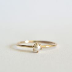 Stunning cultured freshwater pearl ring. Dainty 3mm pearl, this pearl is a beautiful cream white set in a prong setting. Polished for a beautiful shine finish.  *MATERIAL OPTIONS- -14k Solid (Yellow) Gold -14k Solid White Gold *Our 14k solid gold rings are gift wrapped in a beautiful ring box with satin bow. Made to order in your size. Sizes in drop down box are U.S. ring size.  I really want you to be happy with your purchase. If you have any questions or concerns please just let me know:) Yellow Gold Akoya Pearl Ring For Gift, Timeless Pearl White Pearl Ring, Minimalist Round Pearl Ring With Pearl Drop, Fine Jewelry Pearl Drop Ring, Timeless Round Pearl Ring As Gift, Timeless Round Pearl Ring For Gift, Fine Jewelry White Gold Pearl Ring, Timeless Pearl Ring As Gift, Delicate Yellow Gold Pearl Drop Ring