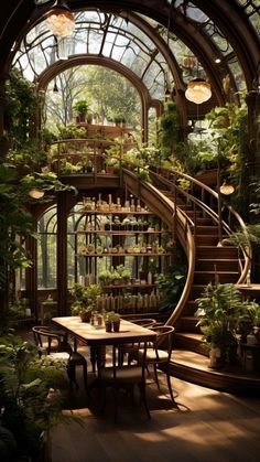 the inside of a greenhouse with lots of plants and stairs leading up to an upper level