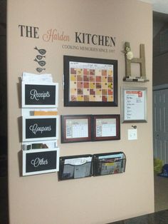 the kitchen is decorated with pictures and magnets on the wall, along with other items