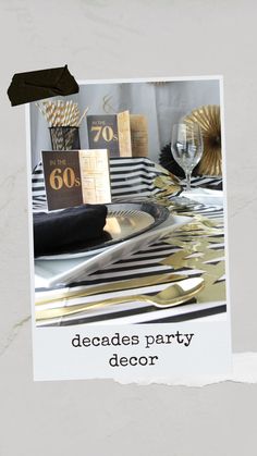 a party table setting with black and gold decorations