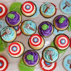 cupcakes with captain america decorations on them