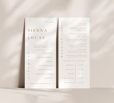 two white wedding program cards on a beige background, with the wording in black and white