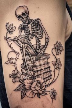 a skeleton sitting on top of a stack of books with flowers and leaves around it