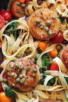 pasta with meat, vegetables and capers in a white bowl on a table top