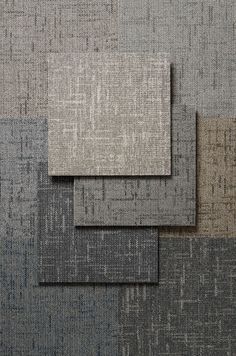 three different shades of gray and grey fabric with squares on them, one in the middle