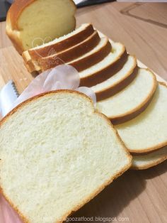 slices of bread on a cutting board with a knife