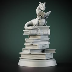 a stack of books with a statue sitting on top of one book and reading a book in the other