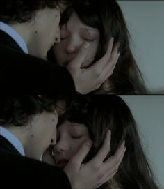 two people that are kissing each other