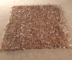 an area rug on the floor that has been cleaned and is brown with white shading