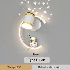 the wall light is designed to look like a moon with stars and a baby on it