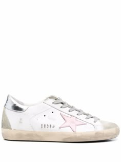 a women's white sneaker with pink star on the side