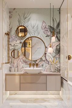 the bathroom is decorated in gold and white with floral wallpaper on the walls, along with an oval mirror above the sink