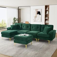 a living room with a green couch and ottoman