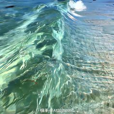 the water is very clear and blue with some waves coming up on it's surface