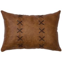 a brown leather pillow with laces on it