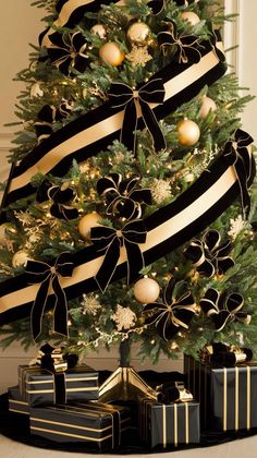 a christmas tree decorated with black and gold ribbons