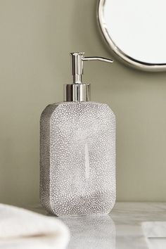 Fashioned from exquisite porcelain and subtly embossed to mimic the authentic texture of shagreen, this exotic accessory set introduces untamed refinement to any bathroom. | Shagreen Bath Dispenser by Kassatex in Grey at Anthropologie