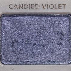 the eyeshade is blue and has brown writing on it, which reads candied violet