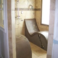 a bathroom with a toilet, shower and bathtub