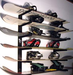 there are many snowboards on this rack