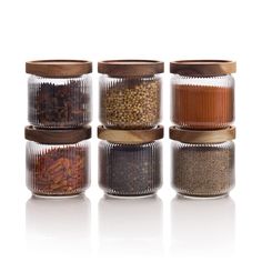 PRICES MAY VARY. INTRODUCING THE MASON & FABLE GLASS STORAGE JARS WITH WOOD LIDS - the perfect storage solution for your kitchen! With an elegant, ribbed pattern, these jars not only look great but also provide ample space to store your spices, tea, coffee, and sugar. Say goodbye to cluttered countertops and hello to organized bliss! OUR UNIQUE RIBBED OR FLUTED DESIGN GLASS JARS are the perfect decorative and versatile addition to your home! These jars are perfect for pantry organization, adding Snack Organizer, Airtight Storage, Organizing Hacks, Kitchen Jars, Spice Tea, Glass Storage Jars, Glass Canisters, Ribbed Glass, Glass Food Storage