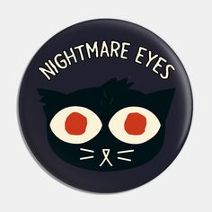 a black button with an image of a cat's eyes and the words nightmares on it