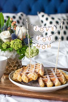 waffles and coffee on a tray with love you mom sign