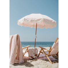 two lawn chairs and an umbrella on the beach