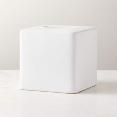 a white square object sitting on top of a table