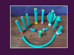 a group of blue and yellow toothbrushes sitting on top of a wooden table