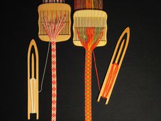 an assortment of different types of hair brushes and combs are displayed on a black background